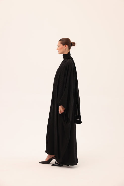 Side view of the ARIA luxury black silk abaya by Tre Sorelle.
